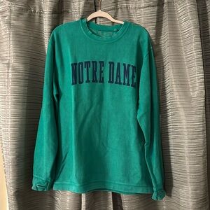 Notre Dame Crew Neck. Color: Green with Navy Lettering. Size: Large.